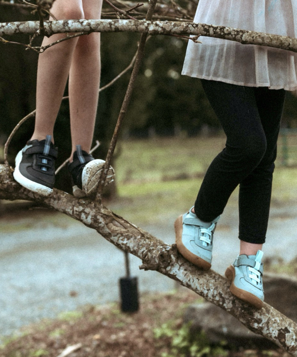 Shop the kid's Skyline Kicker featuring kids climbing a tree.