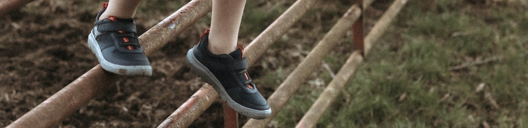 Shop the kids’ Skyline Kicker shoes featuring the low style in blue on a farm fence.