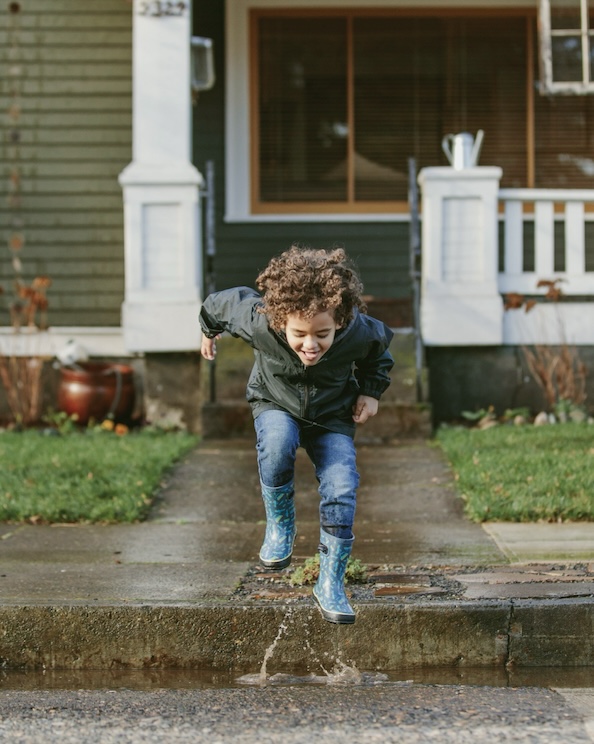Click to shop our sitewide sale featuring a kid jumping in puddles.