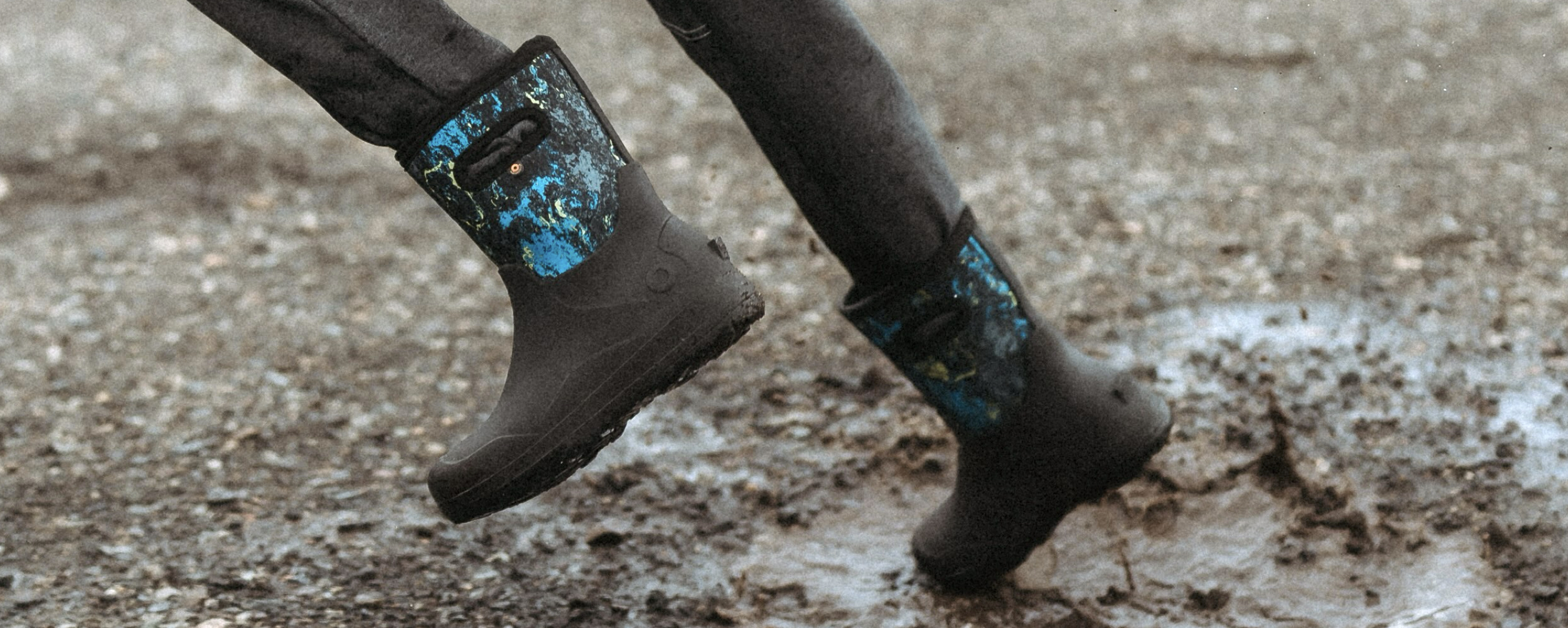 A waist down shot of a kid running through a muddy puddle in our new Kids' York Seamless. Shop our new arrivals.