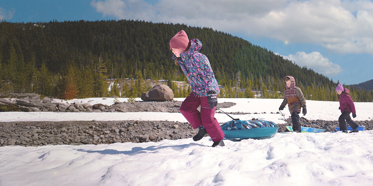 Shop the Kids' York Seamless featuring 3 children pulling sleds in the snow.