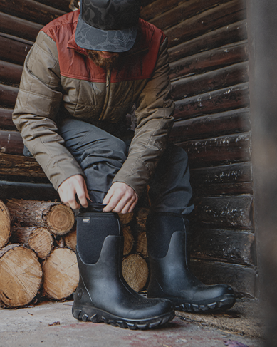 Shop our Seamless Construction featuring a man pulling on boots.