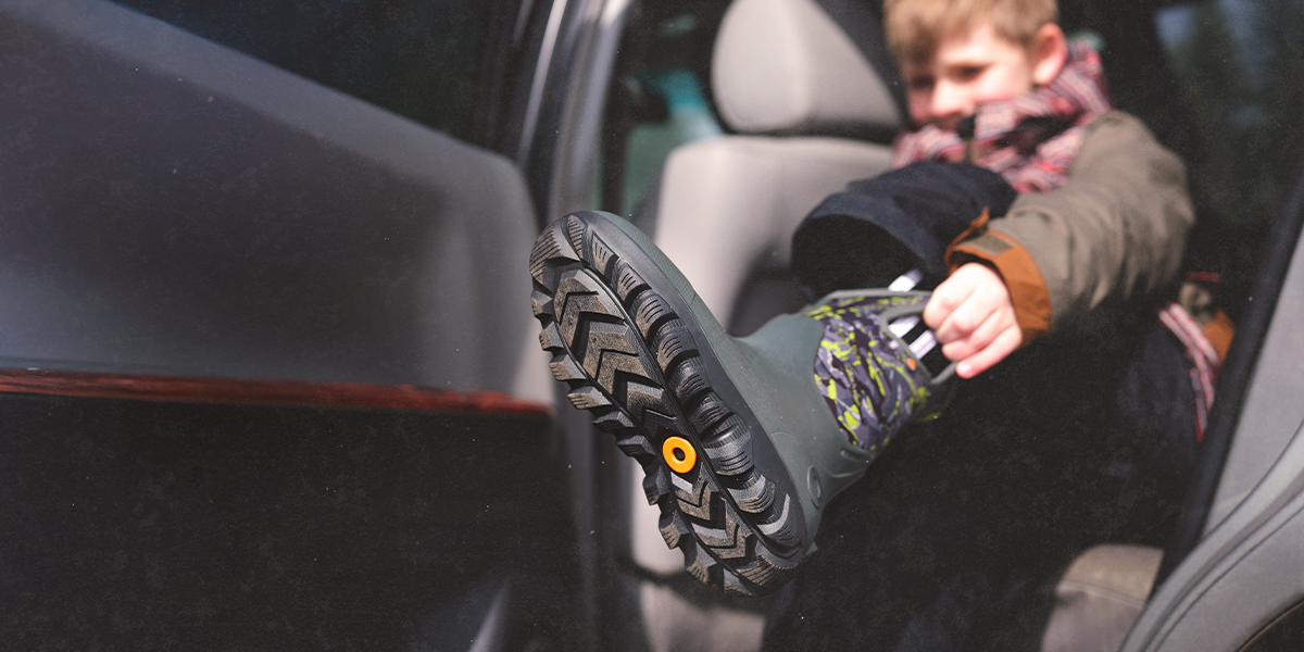 Shop Seamless Construction featuring a boy putting on the York Seamless.