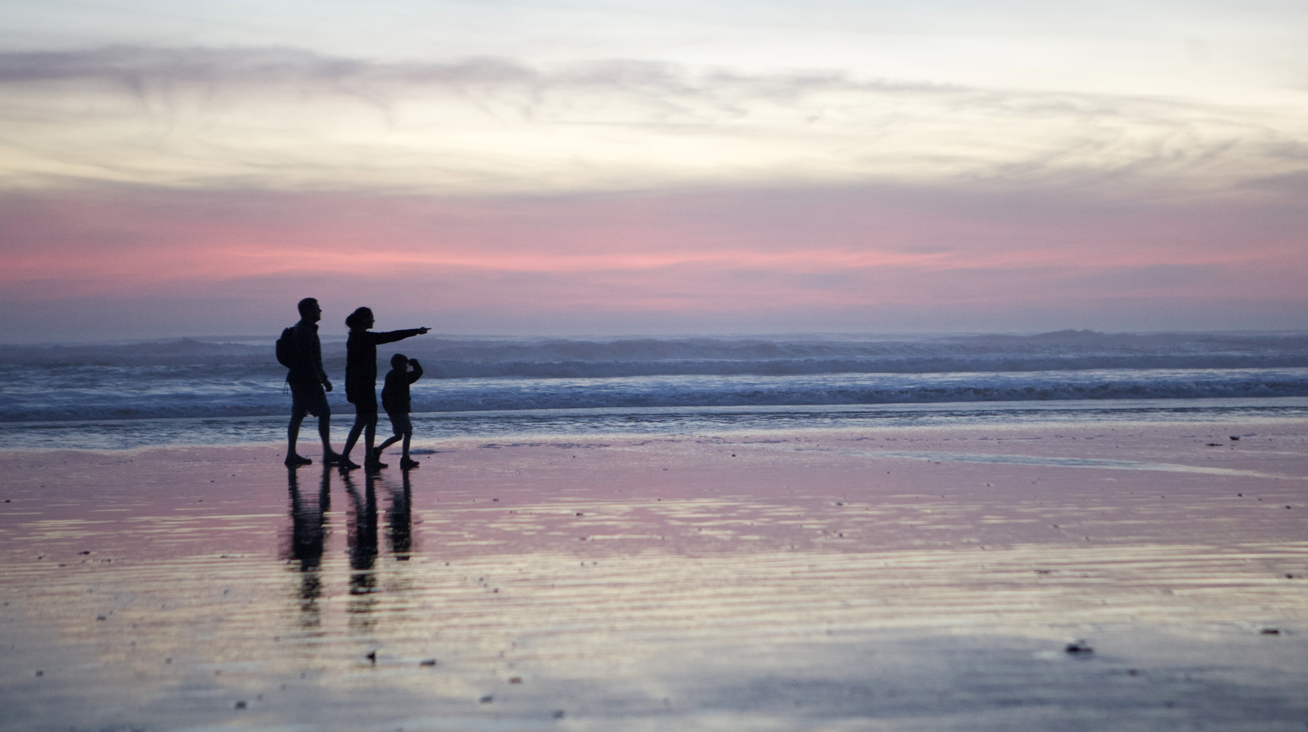 Shop our extended Summer Sale featuring a family walking on the beach. 