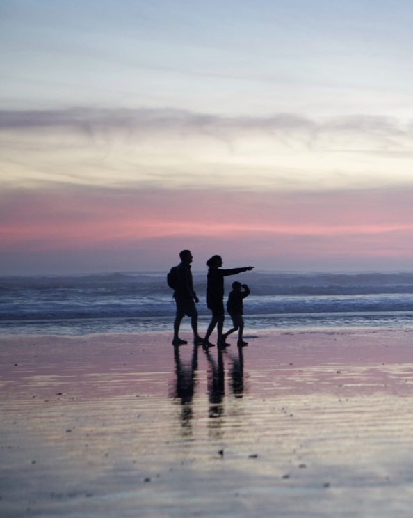 Shop our extended Summer Sale featuring a family walking on the beach. 