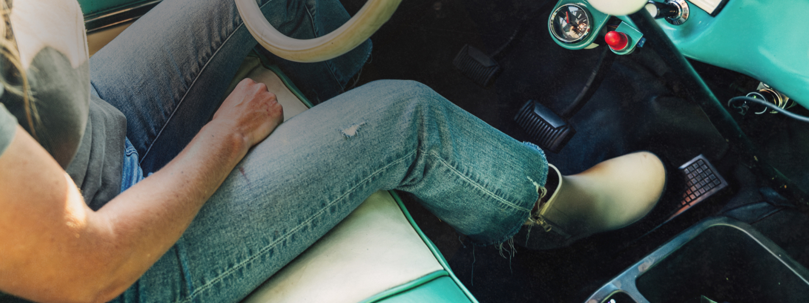Shop the new Piper collection featuring a woman driving an aqua vehicle. 