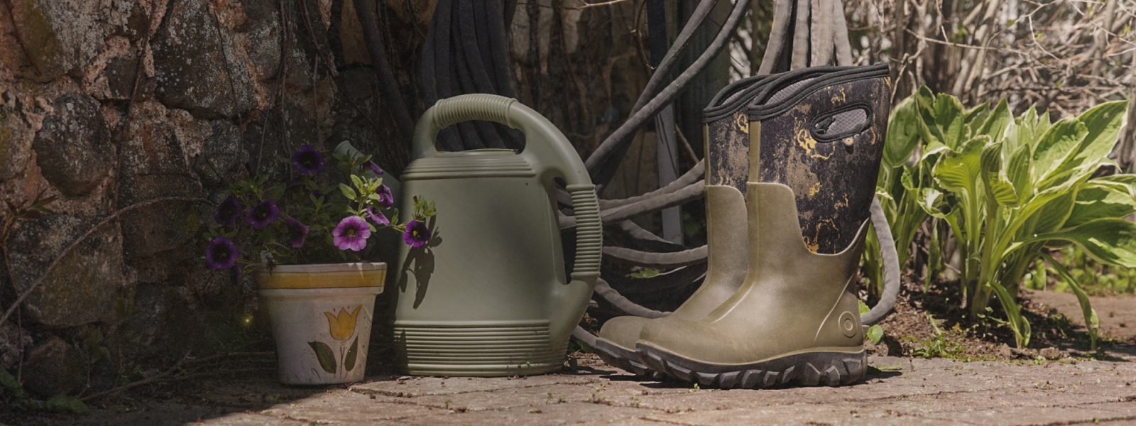 Shop our summer sale featuring a patterned boot next to a watering can. 