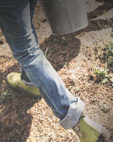 Shop women's garden essentials featuring the Harper in a garden.