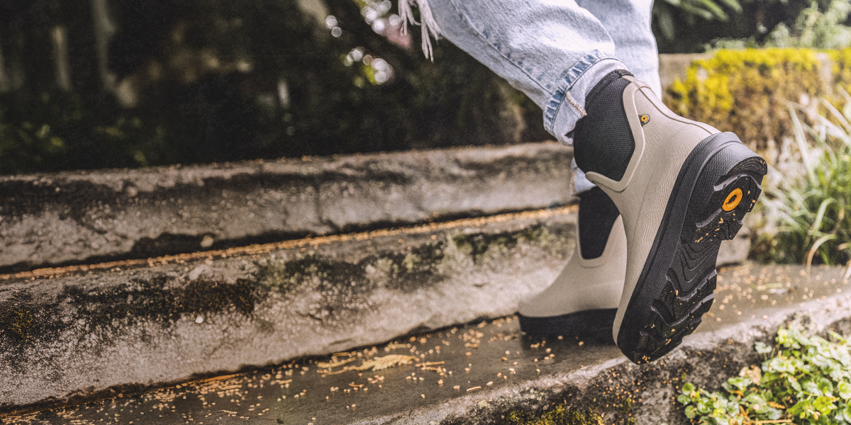 Image features a woman walking up some stairs in the Hazel Chelsea. 